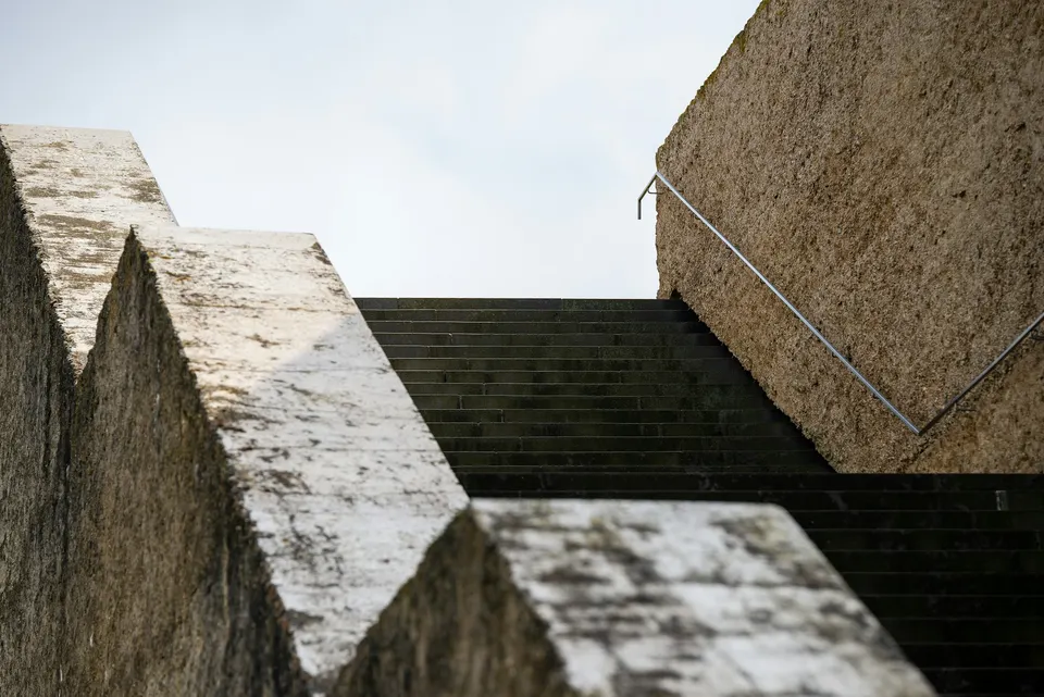 Sculptural pale concrete architecture in warm natural light